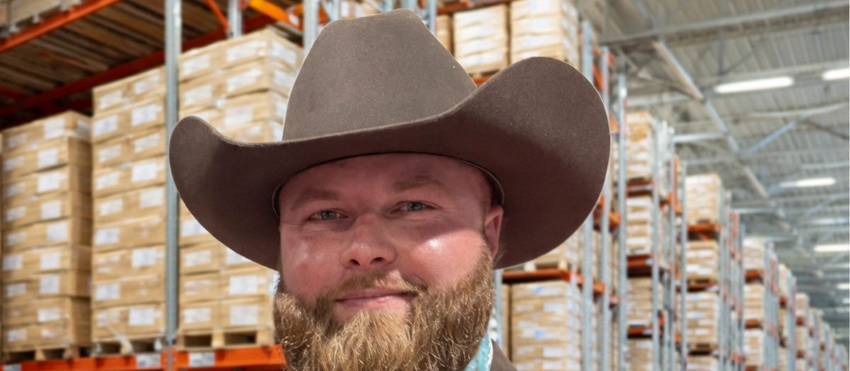 The 3PL Cowboy inside a 3PL warehouse between pallet racking