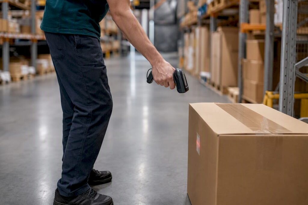 Logistics operator scanning pallet barcode