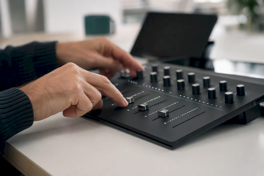 Hands manually tuning an analog forecasting model panel
