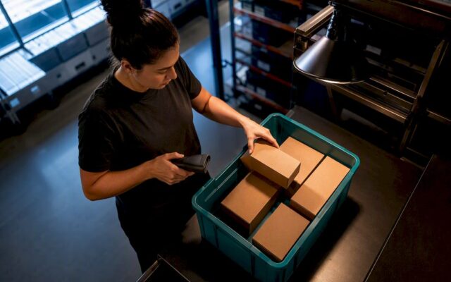 Warehouse associate verifying picked order accuracy