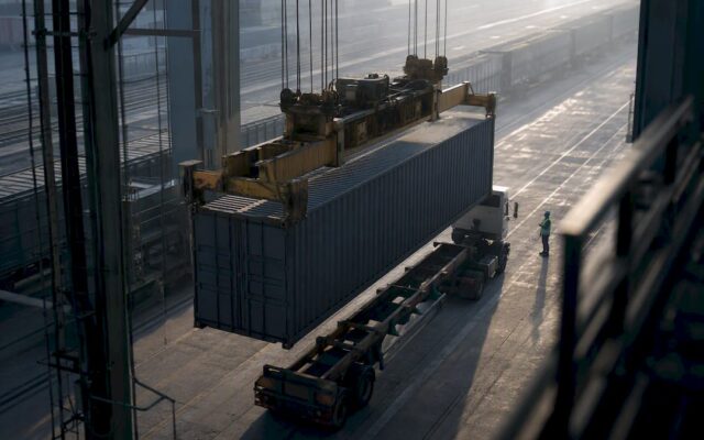 Container transfer at an intermodal rail terminal