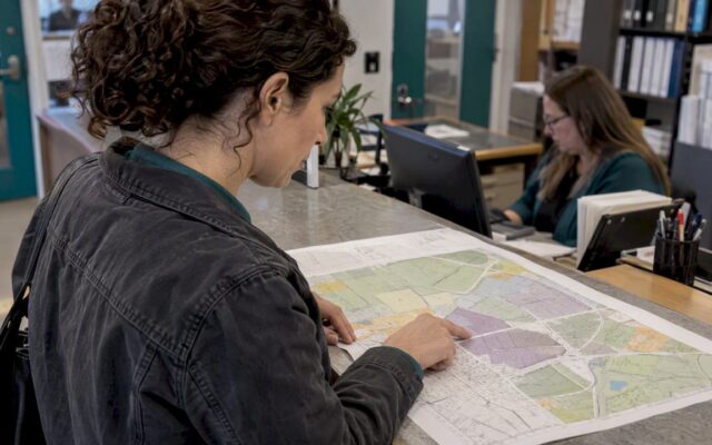 Site buyer checking an industrial zoning map